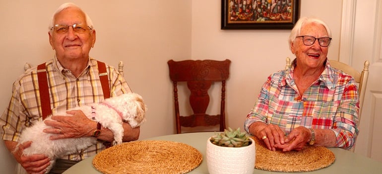 a senior couple sitting at a table