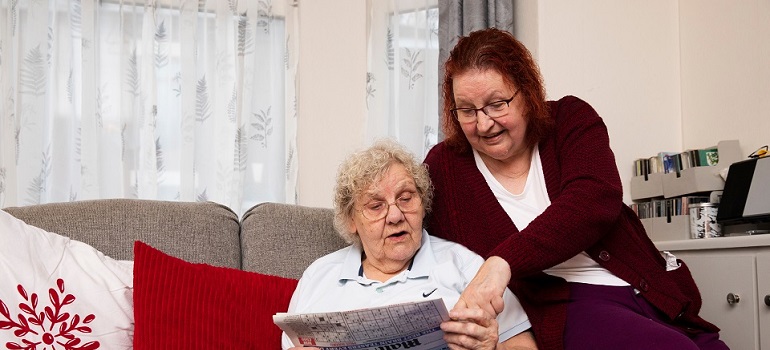 two elderly ladies talking
