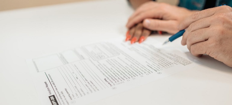a woman writing down living costs in Fort Pierce and Sebastian