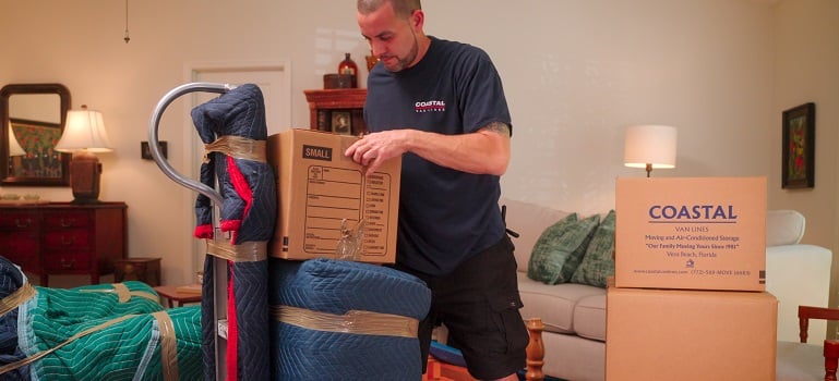 a professional mover helping someone who is moving to another state for the first time