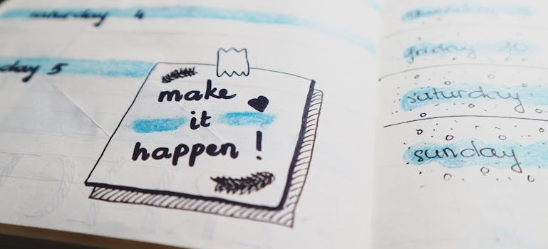 Motivational planning notebook, 'make it happen!'.